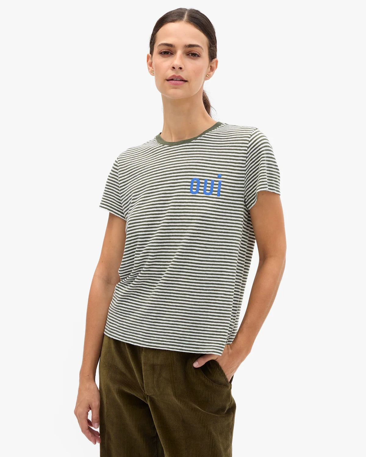model wearing a striped tee with OUI on chest