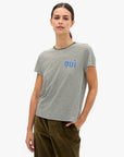 model wearing a striped tee with OUI on chest