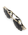 Gold-framed sunglasses with black lenses on a white background