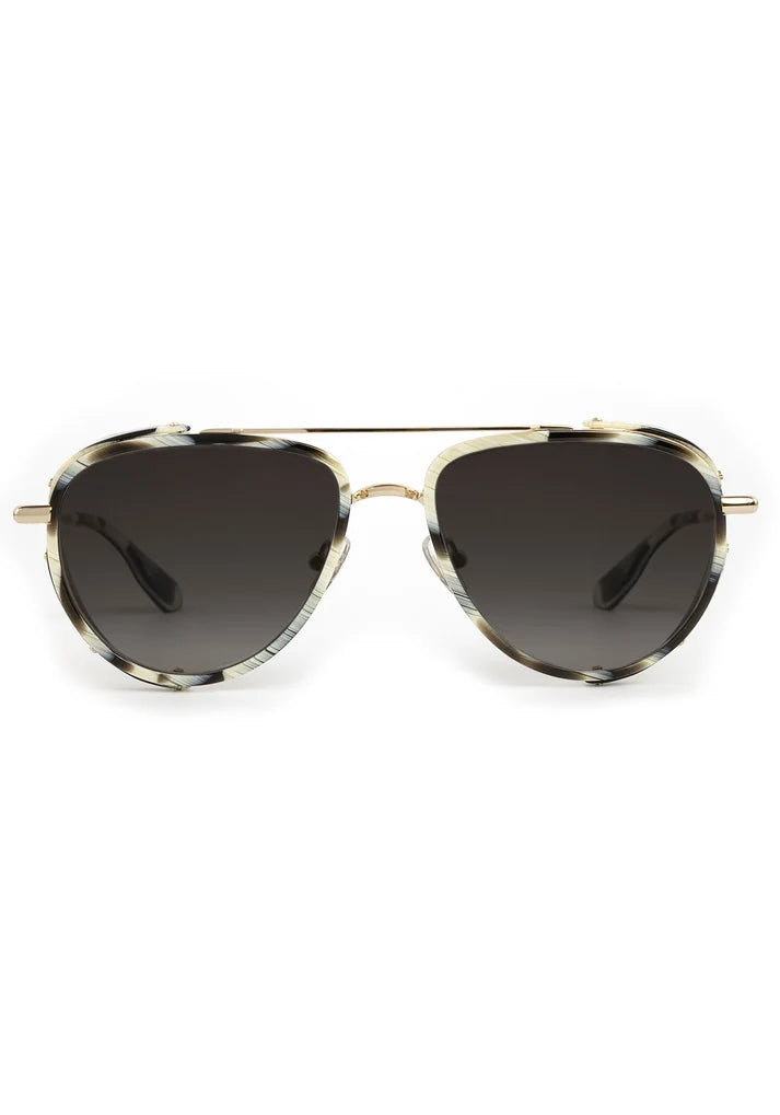 Sunglasses with gold frame and dark lenses on a white background