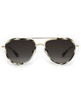 Sunglasses with gold frame and dark lenses on a white background