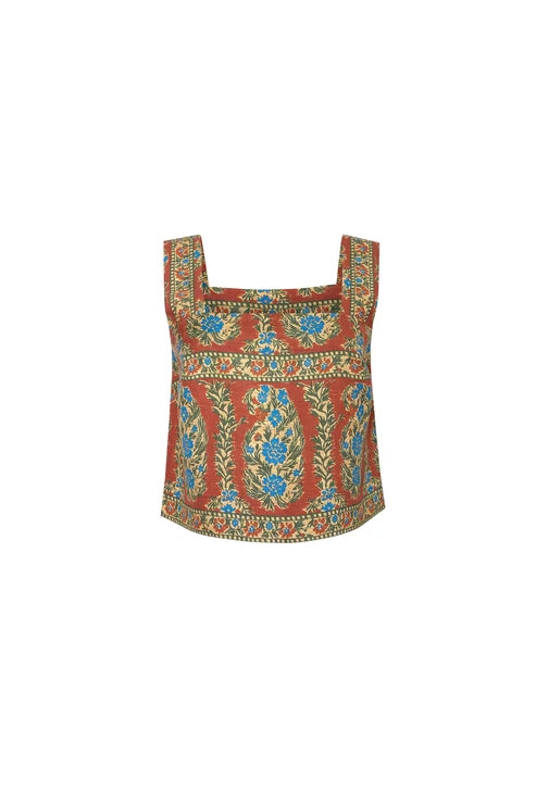 A sleeveless crop top featuring a vibrant red base with intricate blue, green, and gold floral and paisley patterns, presented on a solid white background.