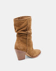 Brown suede boot with a wooden heel on a white background
