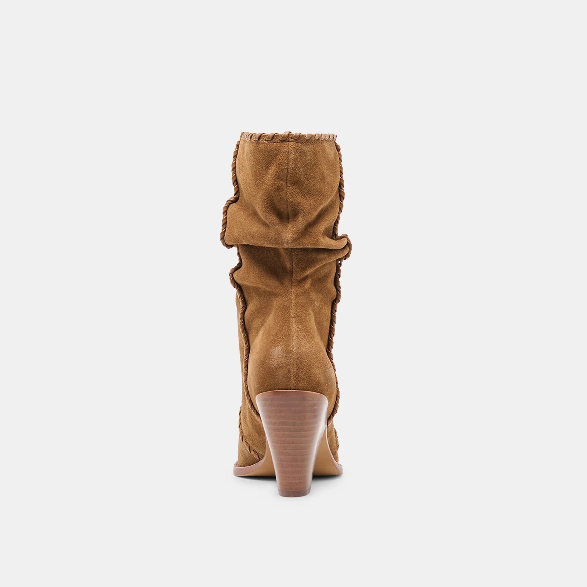 Tan suede boot with a pointed toe on a white background