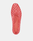 Red shoe sole with textured pattern on a light gray background
