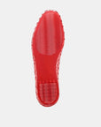 Red shoe sole on a light gray background