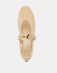 Beige flat shoe with gold accents on a light gray background