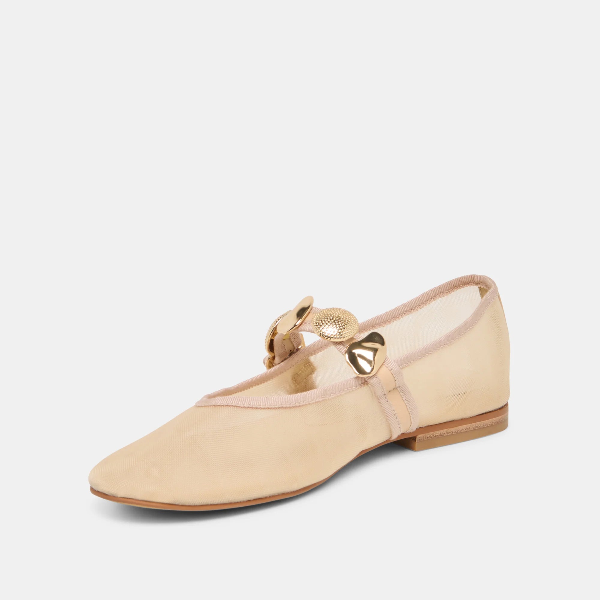Beige flat shoe with a gold strap on a white background