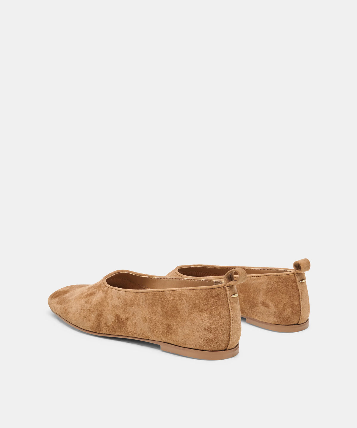 A pair of tan suede flat shoes shown from a rear three-quarter angle on a light gray background.