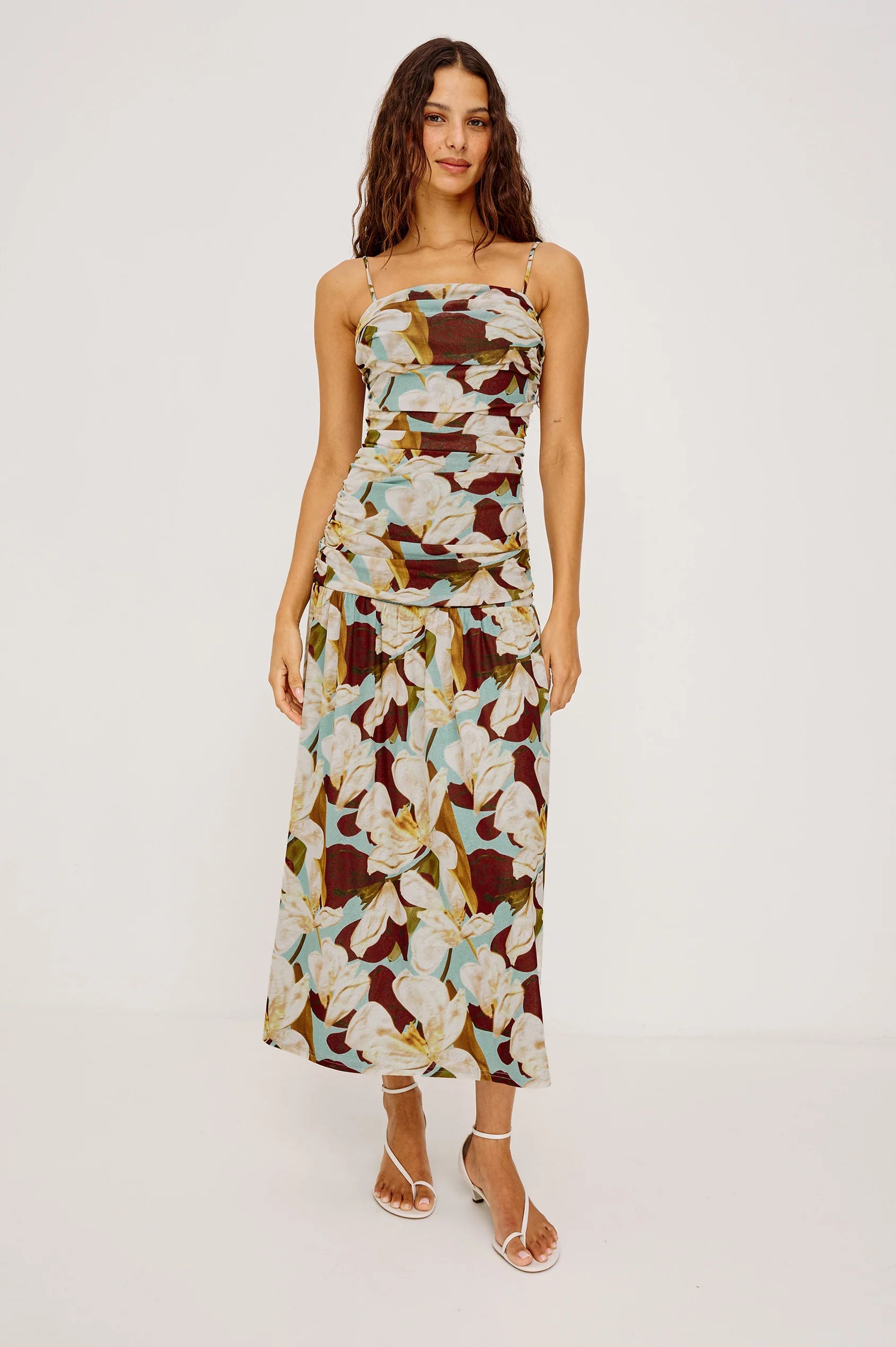 Woman wearing a floral dress on a white background