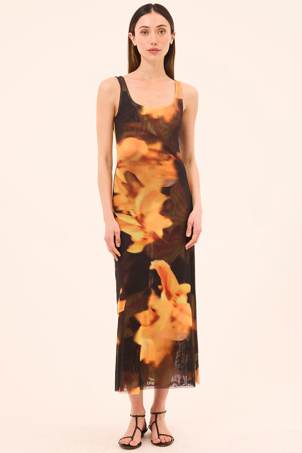 model wearing the khloe yellow flora print dress on a white background