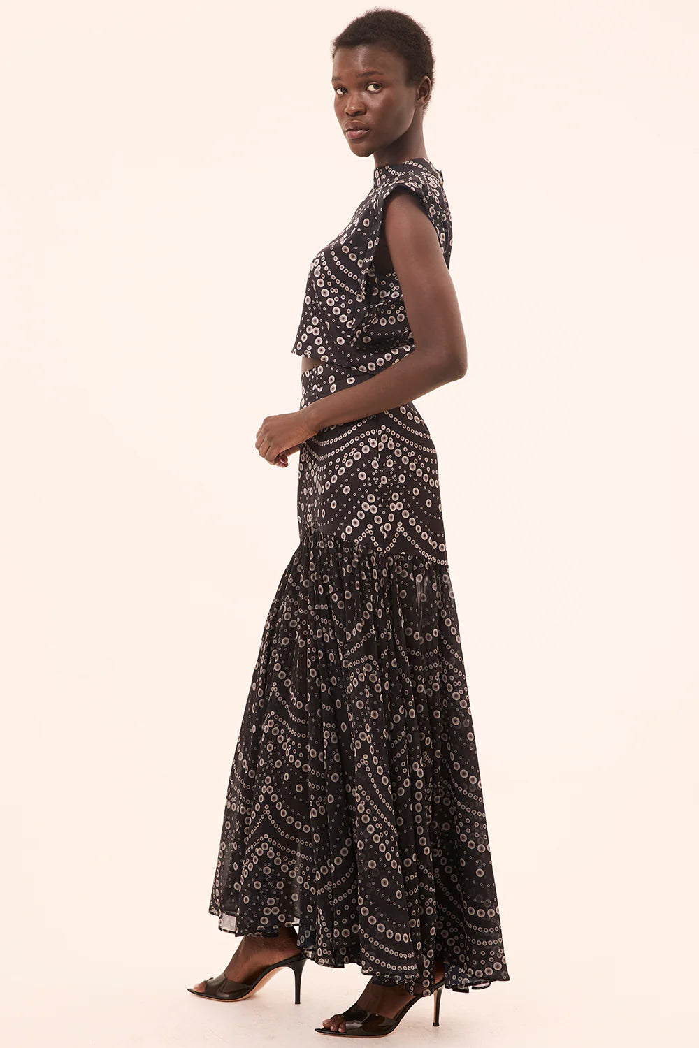 inah stranded pearls top with yara skirt on a model with a cream background