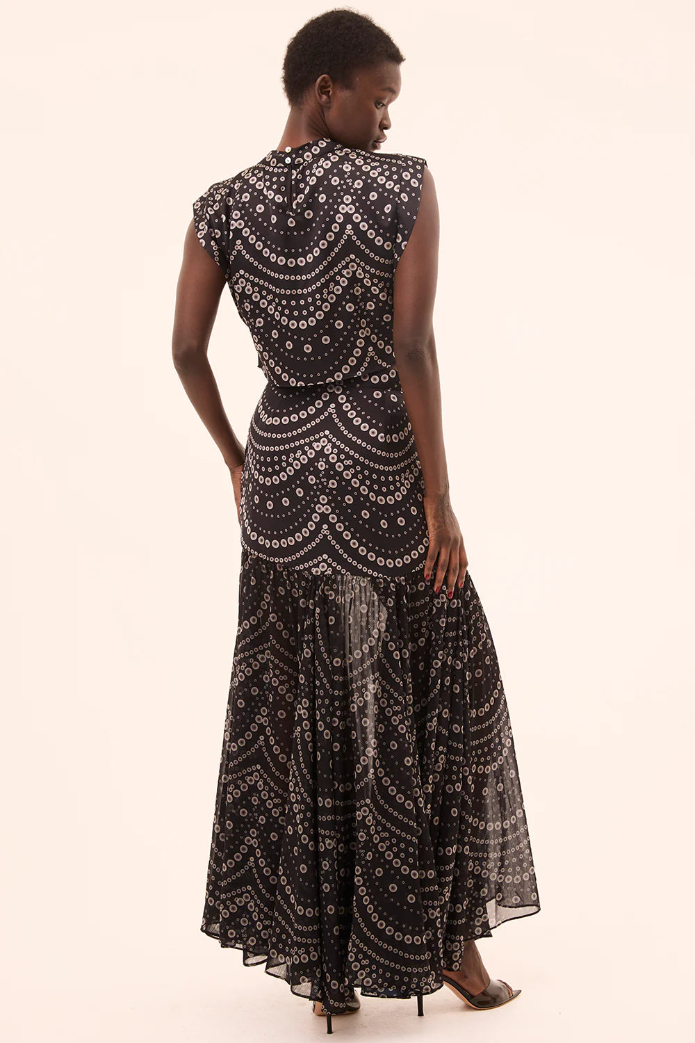 inah stranded pearls top with yara skirt on a model with a cream background