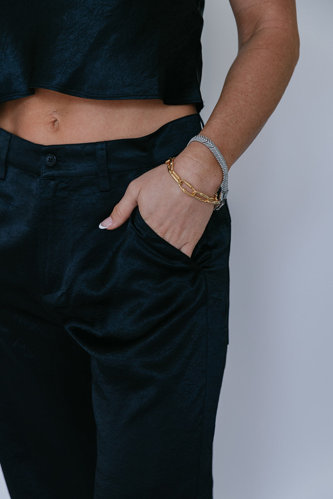 Kait Shine Pant in Black, hand in pocket, close up detail