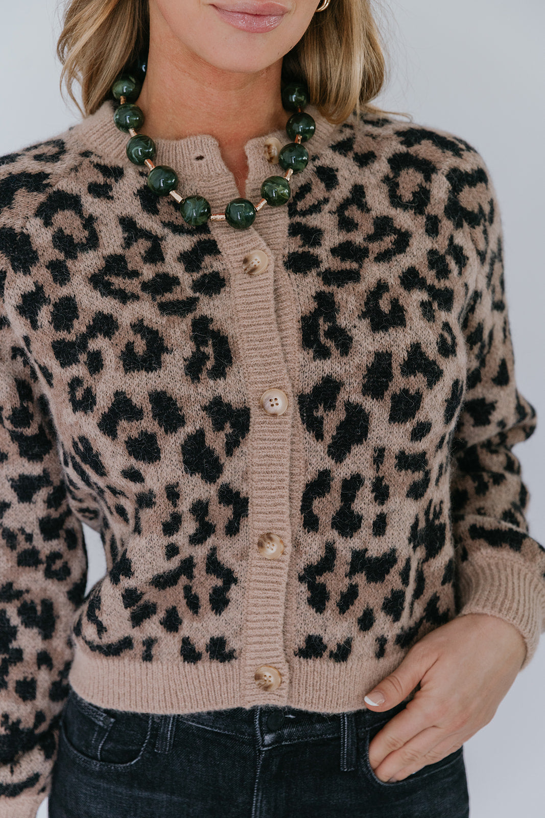 model wearing the leopard windsor cardigan with jeans 