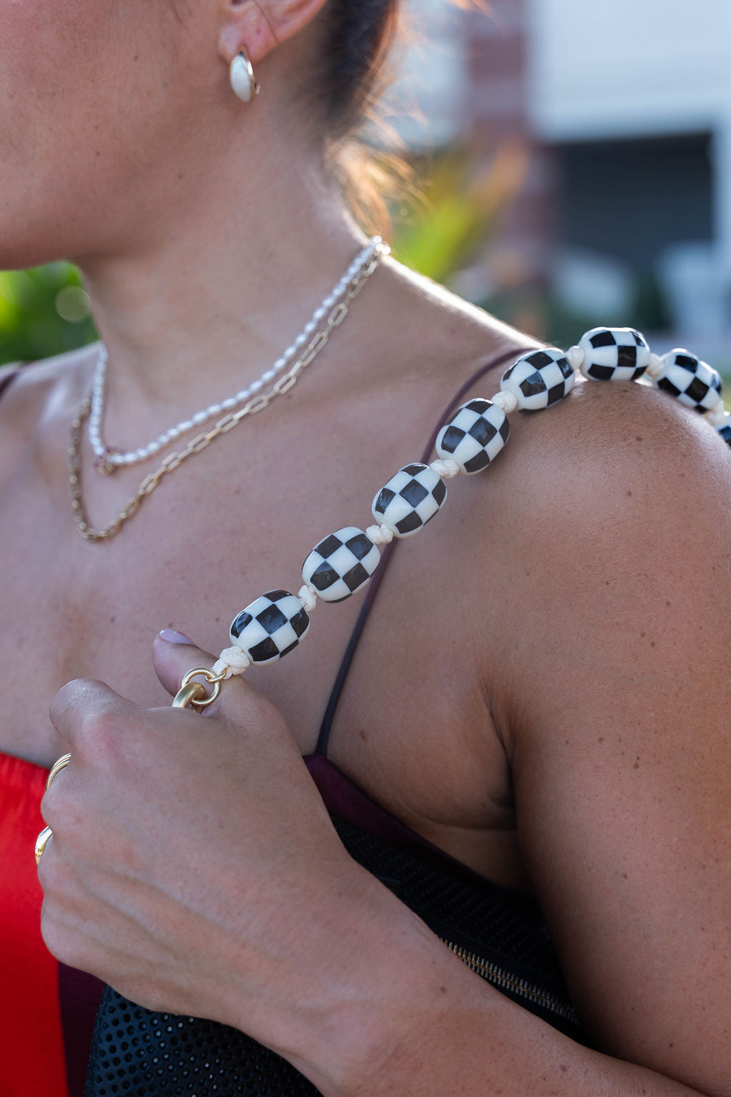 Shortie Strap Checker on shoulder