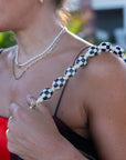 Shortie Strap Checker on shoulder
