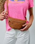 Petite Fanny Tan Rattan worn as crossbody over pink tee