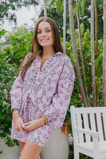 Woman wearing a Bandana Print Button Down standing outdoors with greenery in the background 