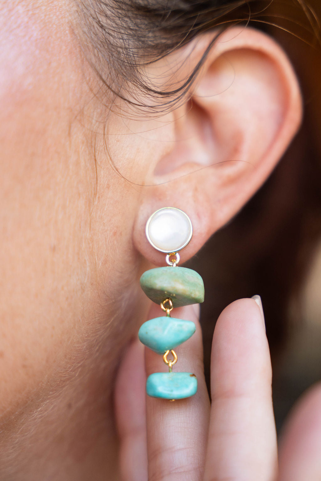 Old World Earrings close up on ear