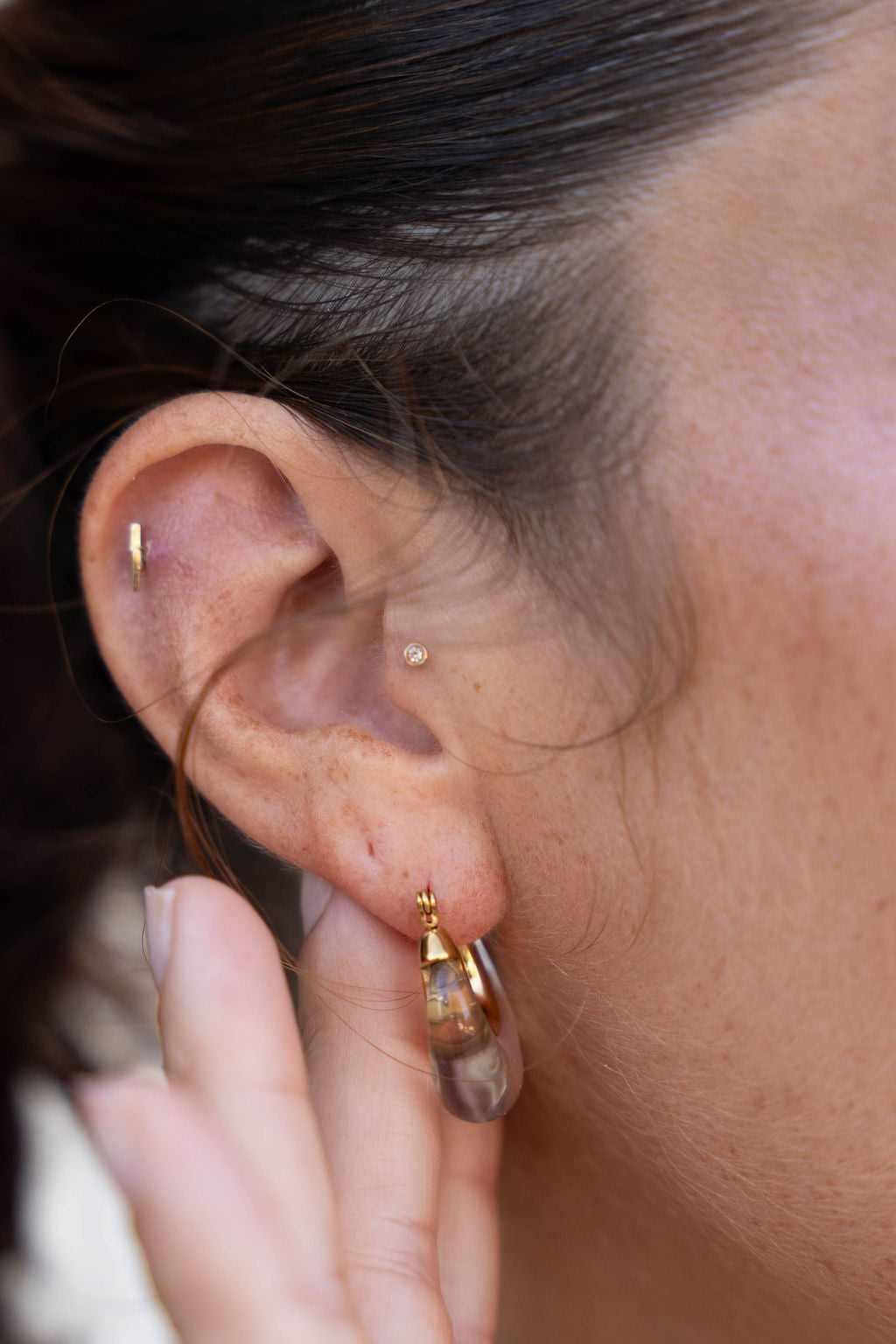 Nina Acrylic Clear Hoop on ear with other earrings
