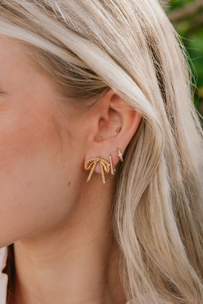 Lele Sadoughi Mini Bow Stud Earrings on model