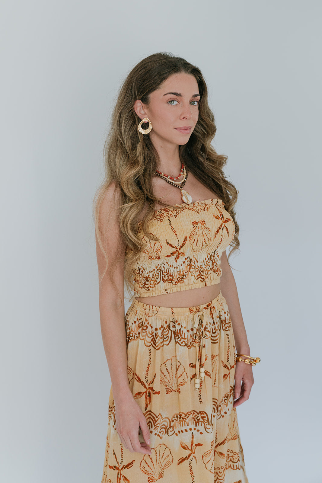 Woman wearing a floral set with a plain background