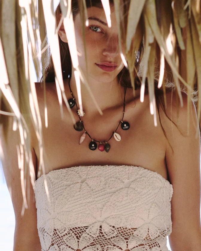 Moku Wrap front view on model behind tree