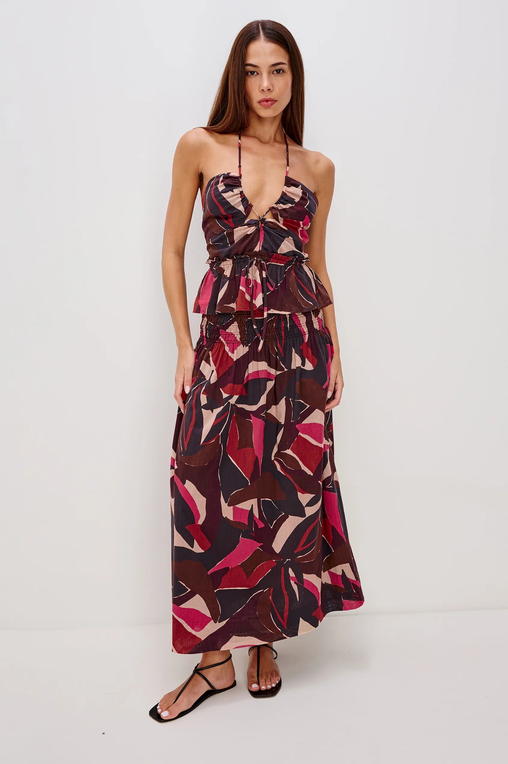 Woman wearing a patterned set on a white background