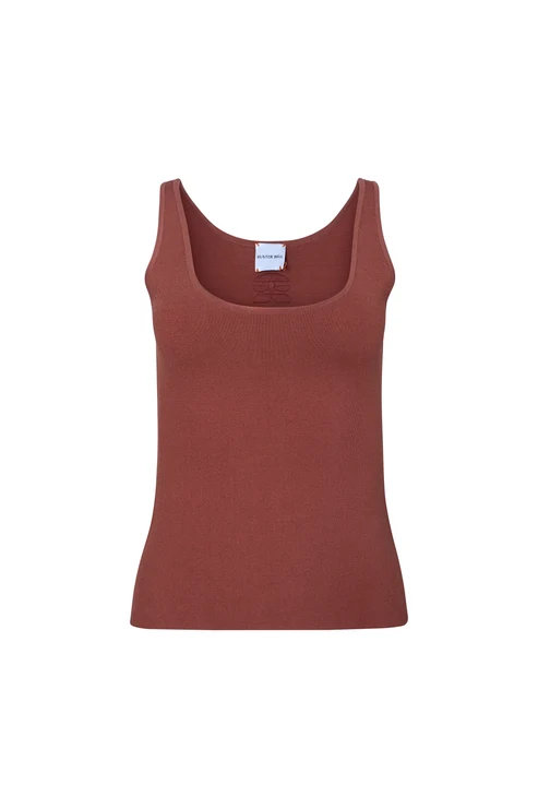 A rust-colored ribbed tank top with a scoop neckline, displayed flat against a solid white background.