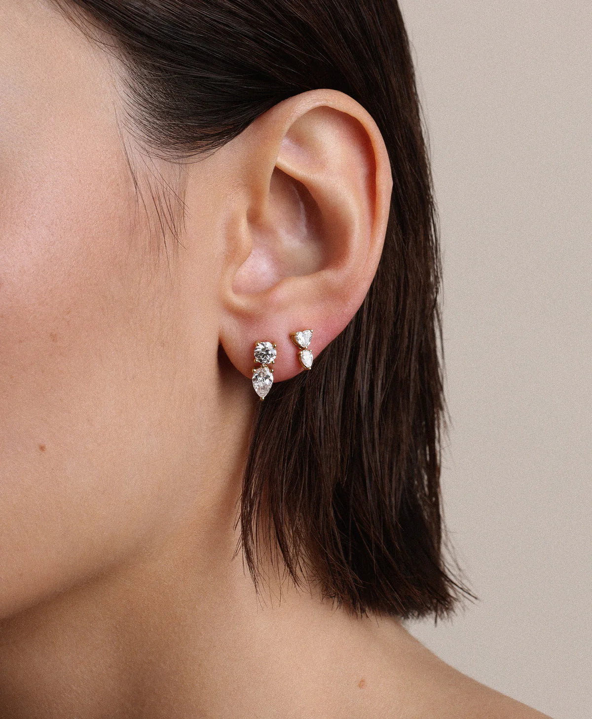 Diamond Heart Drop Earrings on model's ear in second hole
