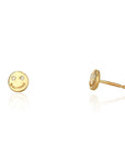 Gold smiley face earrings on a white background