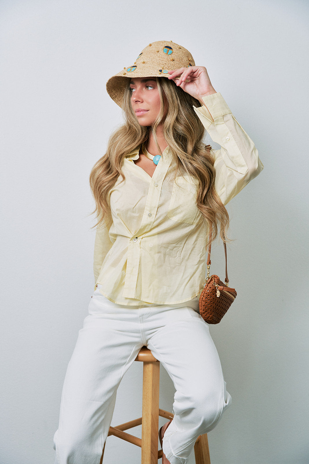 The Daily Sheer Top front with Scarab Embellished Raffia Bucket Hat
