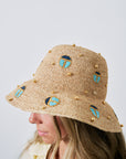 Scarab Embellished Raffia Bucket Hat on model