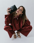 Eli Deco Inspired Clutch model squatting