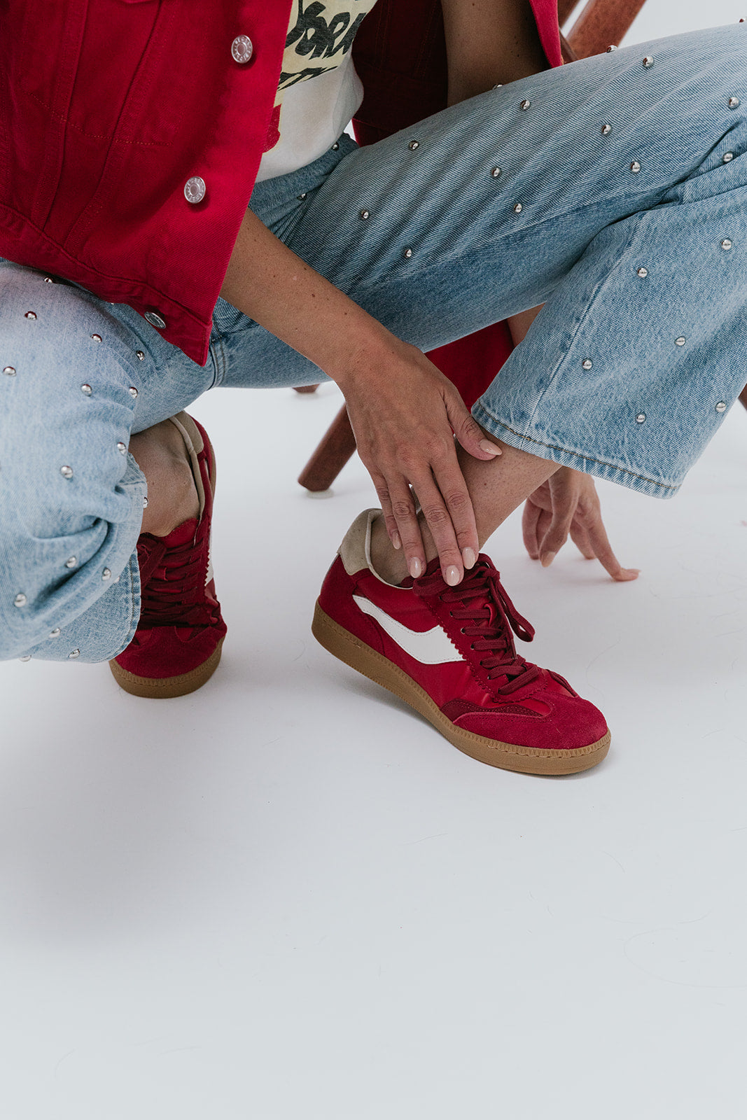 Notice Suede Crimson Sneaker on model close up