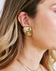 Close-up of a person wearing Rue Earrings Gold