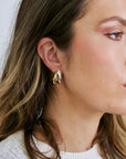Close-up of a woman wearing Florence Earrings in Two-Tone