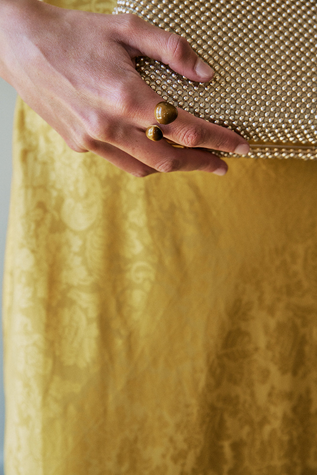 Tiger Eye Gravity Ring with yellow dress