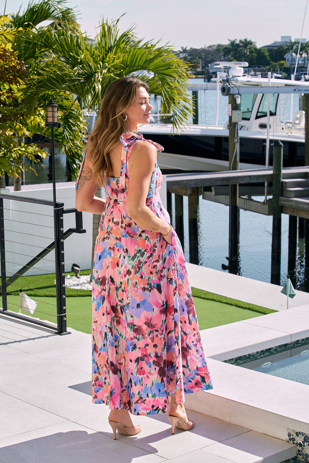 Isla Print Maxi Dress back view, hands in pockets