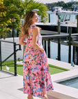 Isla Print Maxi Dress back view, hands in pockets