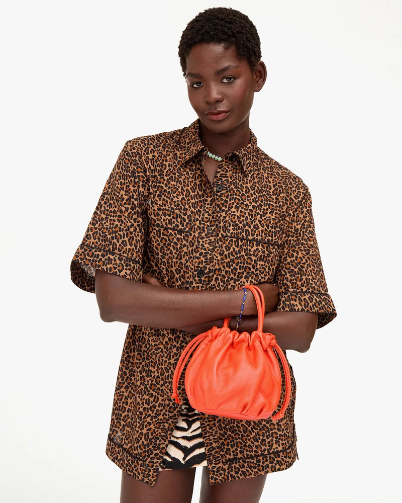 Emma Bag front view of model carrying the bag on her wrist
