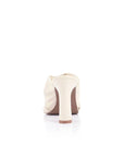 White high-heeled shoe on a white background