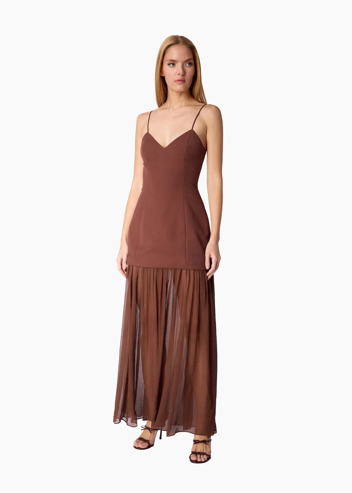 model wearing a brown dress on a white background