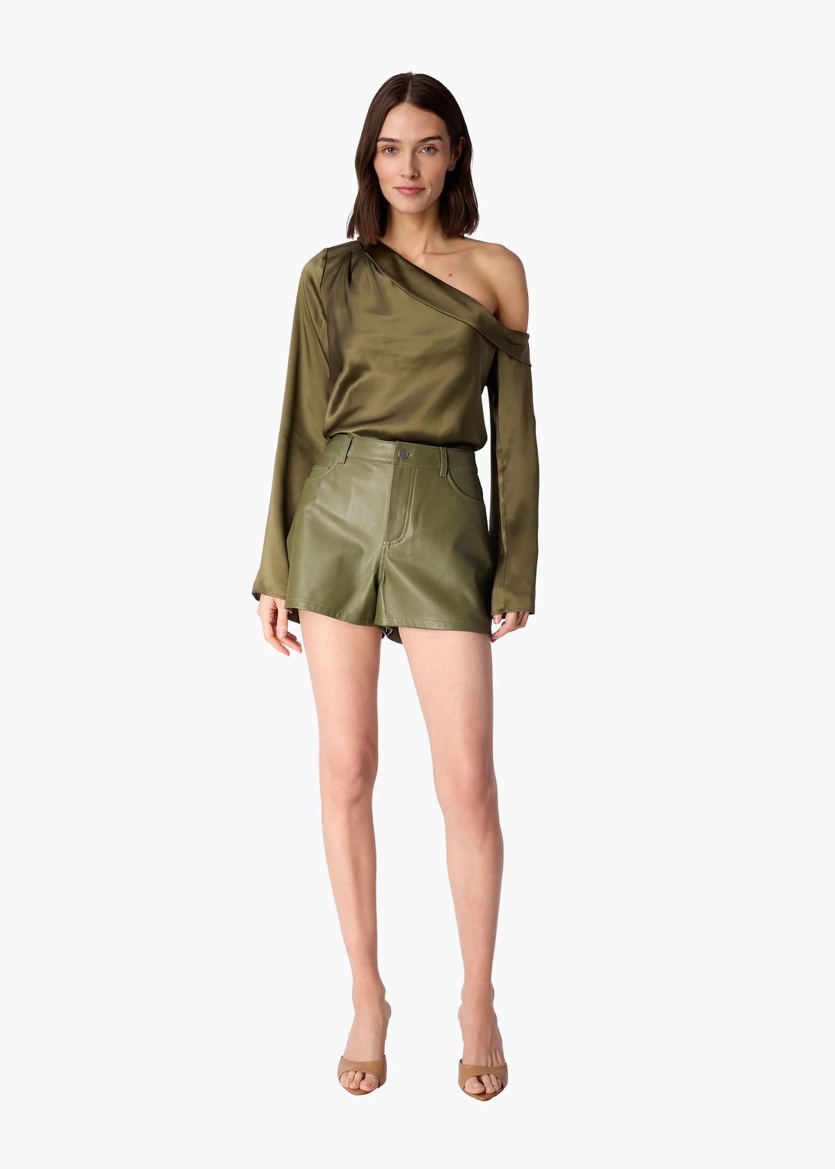 Woman wearing an olive green off-shoulder top and skirt on a white background