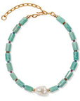 Necklace with turquoise beads and a pearl on a white background