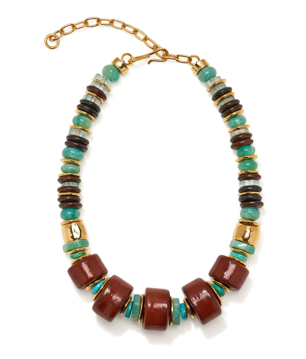A statement beaded necklace featuring large terracotta brown cylindrical beads, small turquoise green beads, and alternating dark brown and light gray striped spacer beads, finished with gold-toned metal spacers and a gold clasp chain.