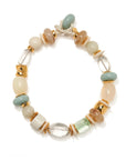 A beaded stretch bracelet featuring a mix of matte cream, sage green, light brown, and clear glass beads, accented with gold-toned spacers and a white rope clasp, shown on a white background.