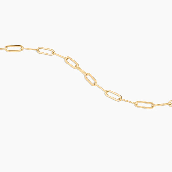 Gold chain necklace on a white background