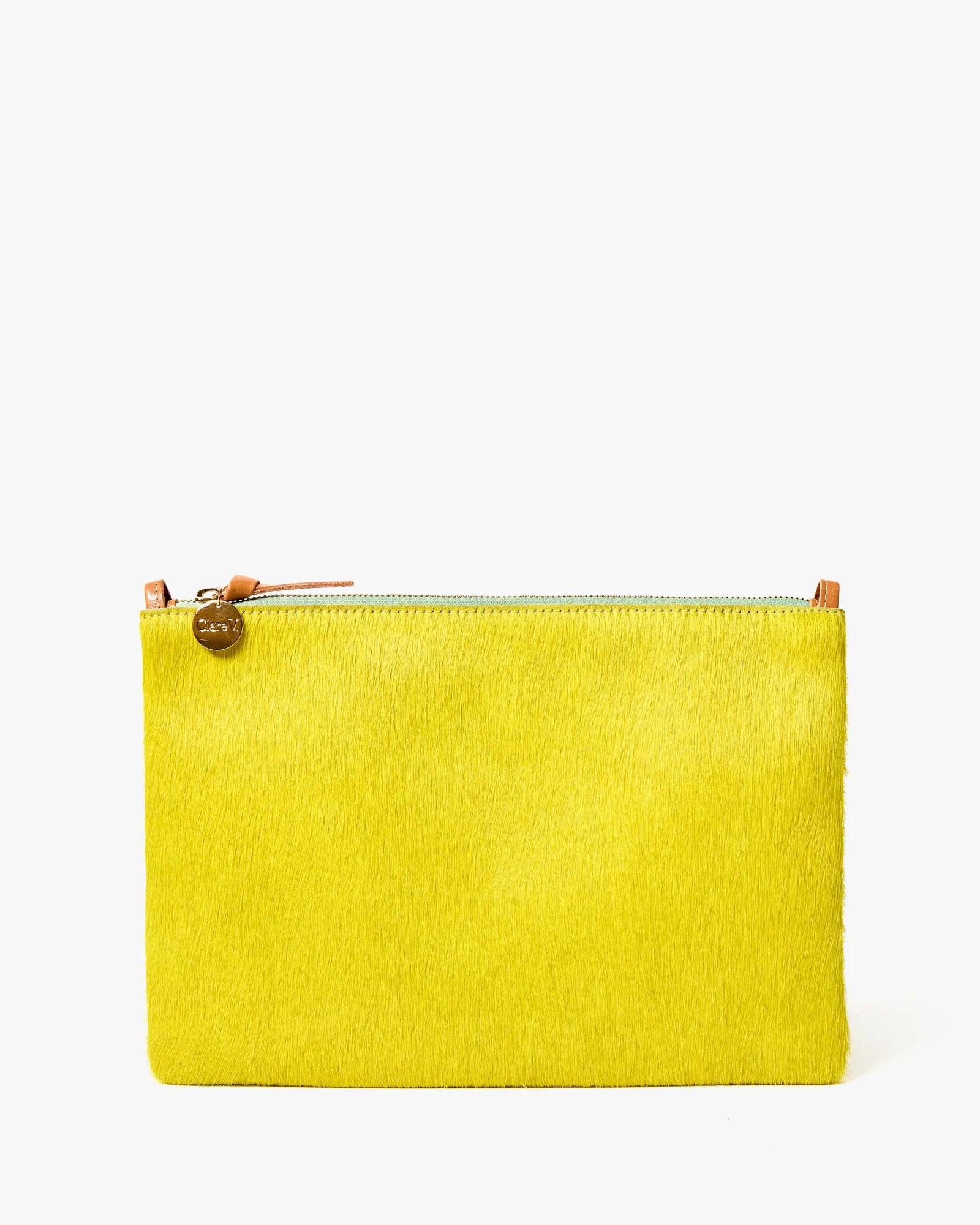 Yellow clutch bag with a gold zipper on a white background